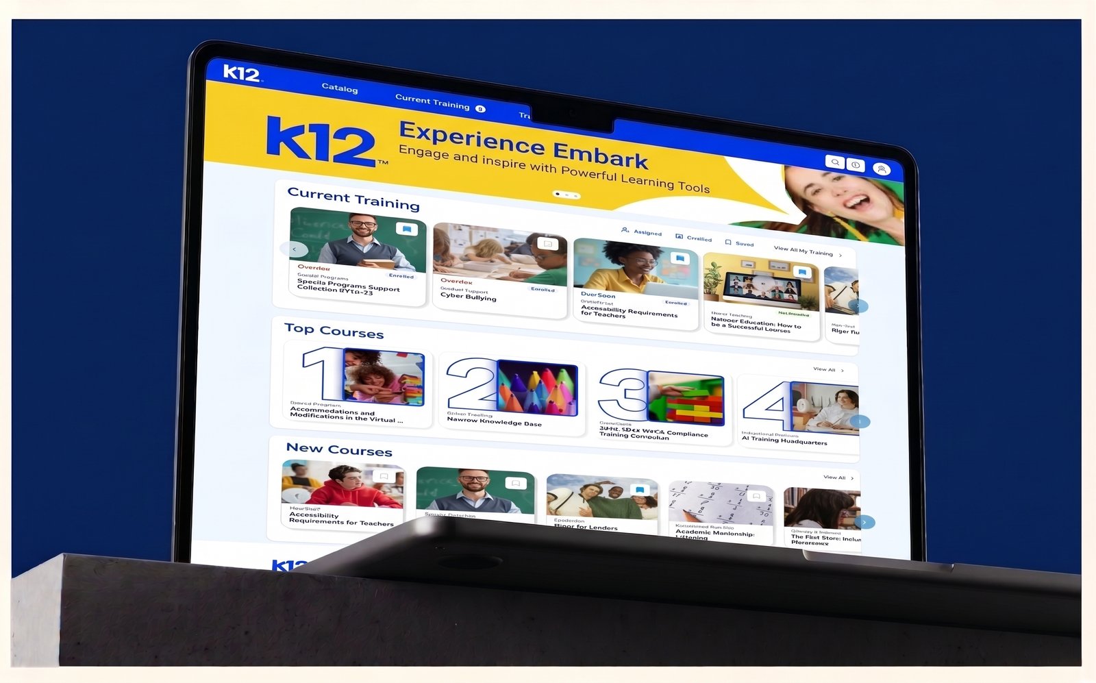Experience Embark training platform shown on a laptop: current training, top courses and new courses carousels of course cards
